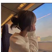 L.